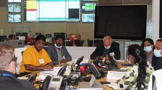 Photo showing visitors from India's Telangana region meeting with EMD staff in a conference room off the Emergency Operations Center of LA City.