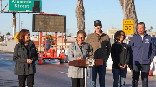 Picture of a press conference on the 10 Freeway, with LA Mayor Bass, Governor Newsom, VP Harris and many others announced it would reopen before Monday, 11/19.