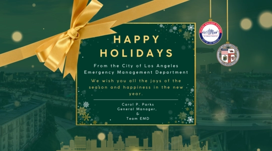 Against a backdrop of City skyline at night a digital holiday card with a yellow bow and the LA City Seal and the logo of EMD hanging down like tree ornaments / TEXT: Happy Holidays from the City of Los Angeles Emergency Management Department. We wish you all the joys of the season and happiness in the new year. / (from) Carol P. Parks, General Manager and Team EMD