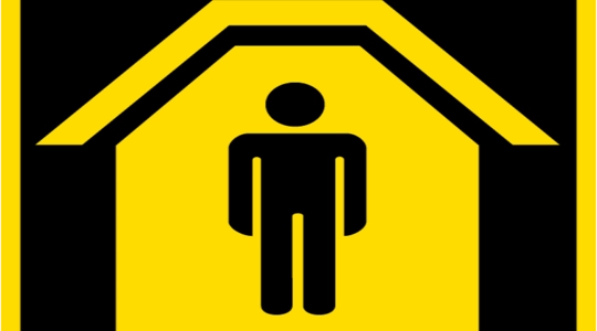 Icon-type image of a human form under a roof indicating "shelter."