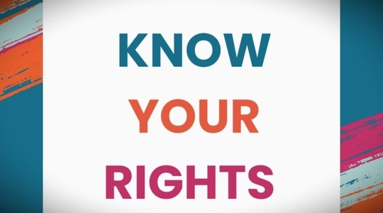 Against a multi-colored diagonally striped background, the words: Know Your Rights