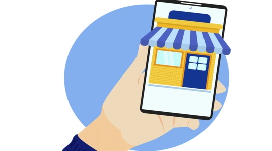 A cartoon hand holds a smart phone with an overlay of a storefront business with a colorful awning
