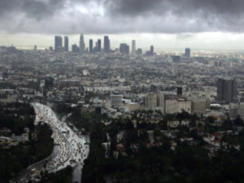 Picture of Los Angeles City skyline with grey storm clouds in the sky 