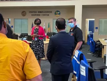 EMD's Carol Parks and Jon Brown are shown in L.A. City's Emergency Operations Center fielding questions from a group of emergency managers from the nation of India.