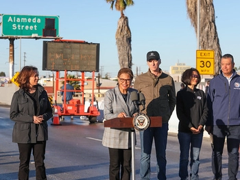 Picture of a press conference on the 10 Freeway, with LA Mayor Bass, Governor Newsom, VP Harris and many others announced it would reopen before Monday, 11/19.
