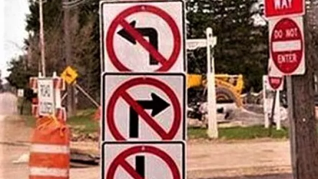 Image of conflicting and confusing street-turn signs