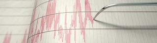 Image shows a seismograph recording a large earthquake.