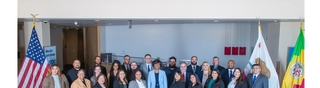 A group photo of the staff of LA City Emegency Management in th lobby of the Emergency Operations Center downtown.
