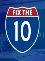 Against a backdrop of burned freeway overpass, a red & blue emblem similar to highway road signs includes the text: FIX THE 10